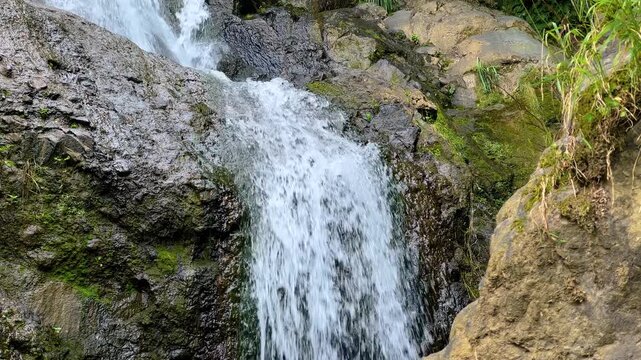 Andrew the Apostle waterfall in the mountain in Batumi, Georgia - river or water stream flowing and falling down: close up. Nature, landscape and environment concept
