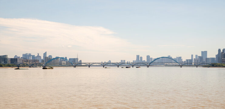 Fuxing Bridge across Qiantang River, Hangzhou urban skyline, China