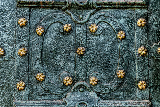 Verdigris metal with gold flower decorations.