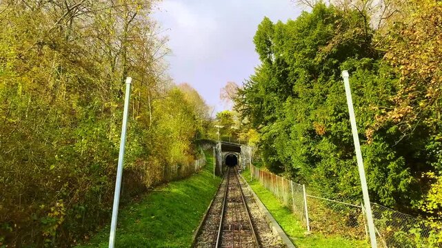 Mountain Train and Tunnel in a Sunny Autumn Day in Biel, Bienne, Canton Bern, Switzerland