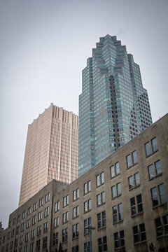 Business skyscrapers and high rise office towers stand in downtown Toronto, Canada showing a typical North American CBD with glass facades, corporate buildings and dense urban architecture.