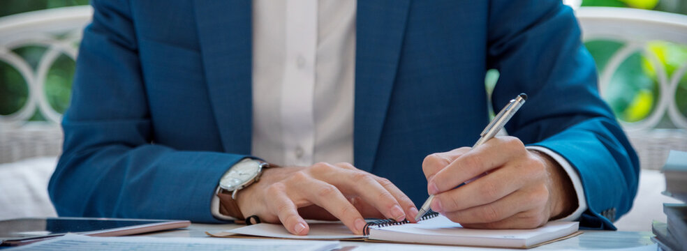 Banner Close up hand man colleagues meeting mergers and acquisitions business. Banner Two Businessman signing contract document dealing teamwork. Partners Signed document at office with copy space