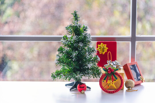 Background Christmas tree decorated holiday winter xmas celebration present gift decorate bauble ornament golden ball in cozy living room. Merry Christmas happy new year festival traditional concept