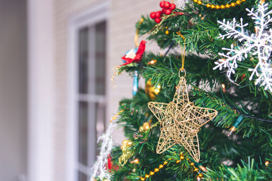 Background Christmas tree decorated holiday winter xmas celebration present gift decorate bauble ornament golden ball in cozy living room. Merry Christmas happy new year festival traditional concept