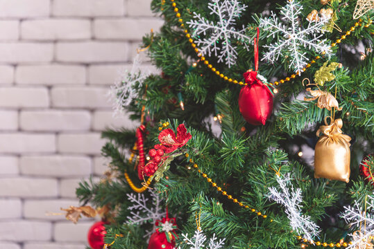 Background Christmas tree decorated holiday winter xmas celebration present gift decorate bauble ornament golden ball in cozy living room. Merry Christmas happy new year festival traditional concept