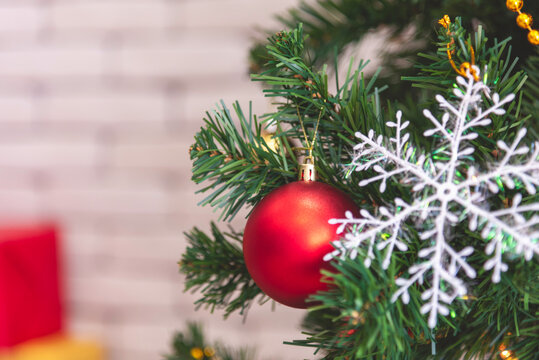 Background Christmas tree decorated holiday winter xmas celebration present gift decorate bauble ornament golden ball in cozy living room. Merry Christmas happy new year festival traditional concept