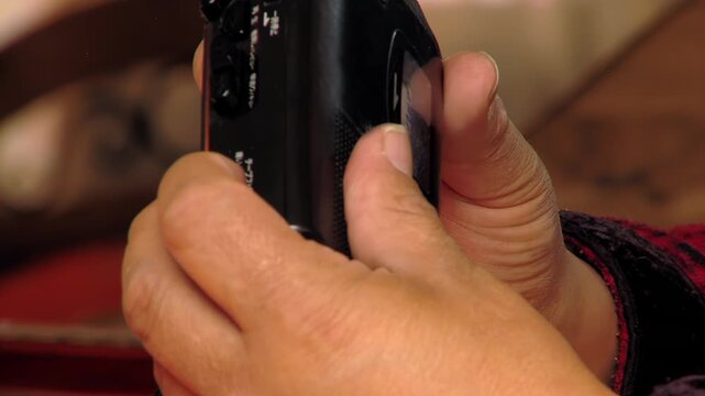 Hand Pressing Controls On Vintage Walkman Style Cassette Player - 4K