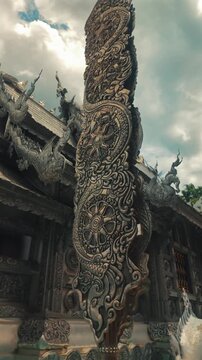 intricate Silver Temple architecture displaying carved metal relief, detailed Chiang Mai buddhist shrine Wat Sri Suphan exterior featuring traditional asian handmade ornament 4k