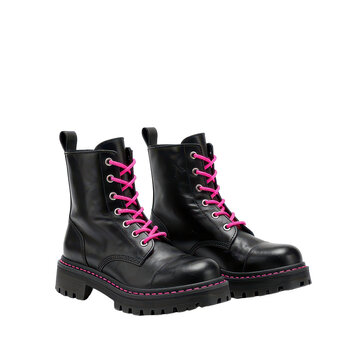 Black boots with pink laces isolated on black background