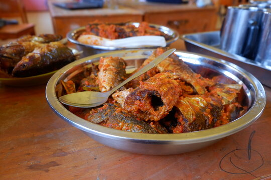 Spicy Indonesian Fried Fish with Red Sambal Chili Sauce in Metal Bowl