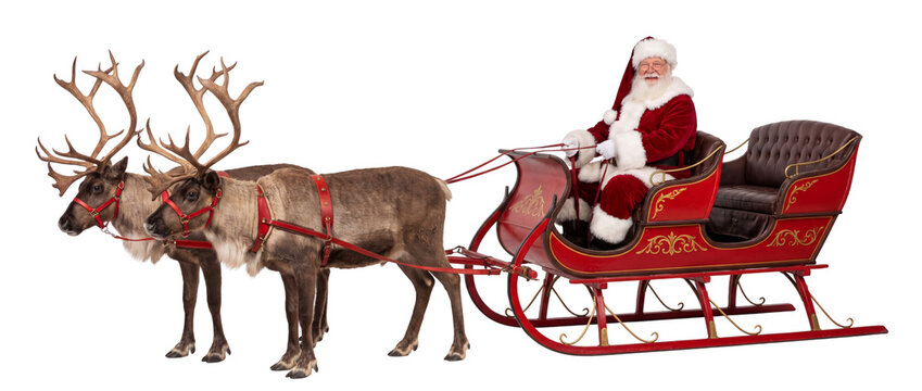 Santa Claus riding red sleigh pulled by reindeer