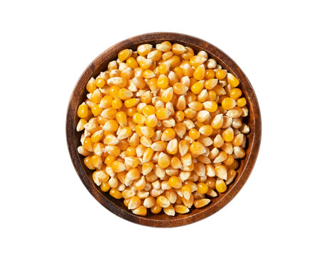 Top view of unpopped popcorn kernels in a wooden bowl isolated on transparent background