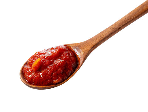 Tomato sauce on wooden spoon isolated on transparent background
