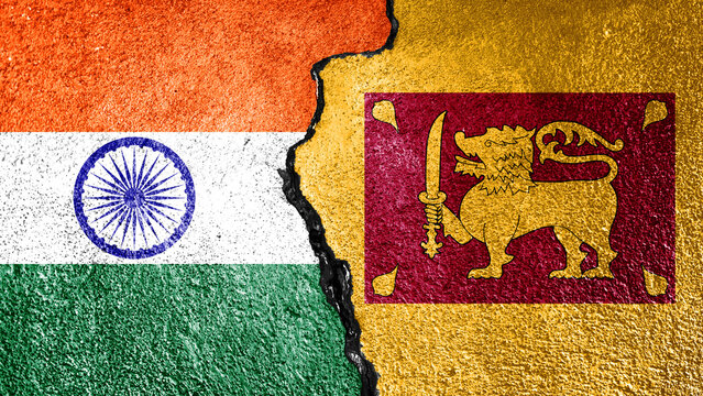 India and Sri Lanka flags painted on rough stone wall with vertical crack illustrate maritime border issues diplomatic cooperation and regional influence dynamics.