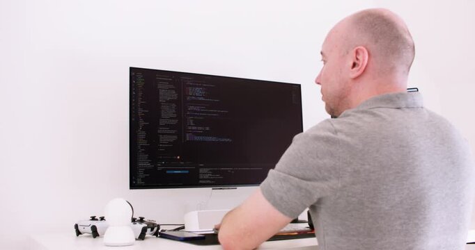 Programming process. Tech engineer occupation. Male frontend expert checking script on digital display at white background free space.