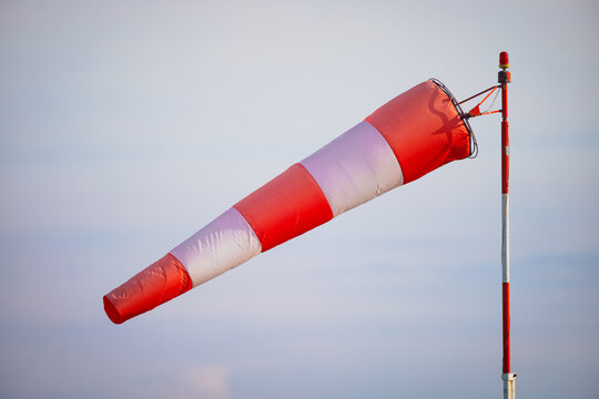 Details with a windsock on the runway of an airport