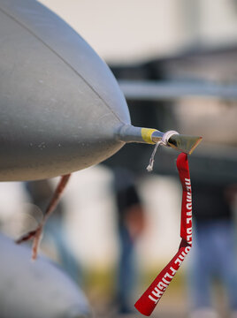 Details with the &ldquo;Remove before flight&rdquo; ribbon on a fighter jet plane