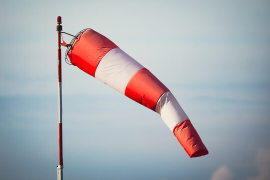 Details with a windsock on the runway of an airport