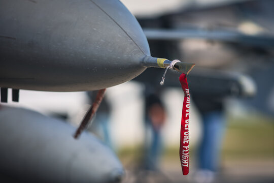 Details with the &ldquo;Remove before flight&rdquo; ribbon on a fighter jet plane