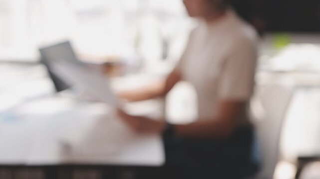Closeup of the hands of a receptionist typing and sending emails while working in an office alone. One secretary doing admin and writing reports while organizing a schedule for her manager at work