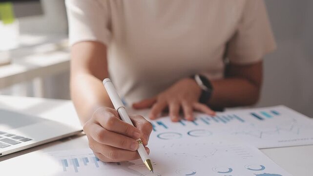 Closeup of the hands of a receptionist typing and sending emails while working in an office alone. One secretary doing admin and writing reports while organizing a schedule for her manager at work