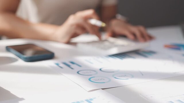 Closeup of the hands of a receptionist typing and sending emails while working in an office alone. One secretary doing admin and writing reports while organizing a schedule for her manager at work