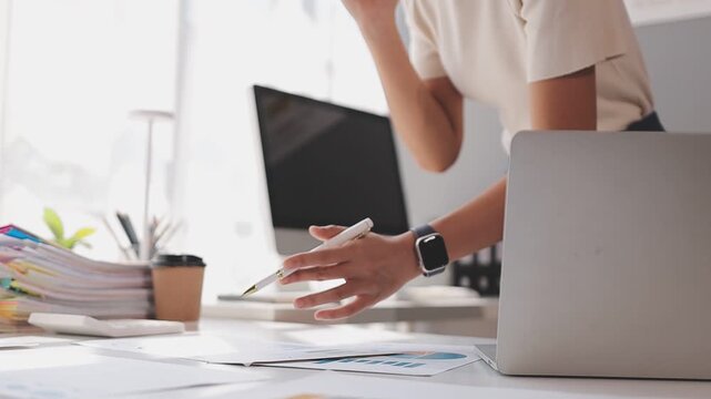 Closeup of the hands of a receptionist typing and sending emails while working in an office alone. One secretary doing admin and writing reports while organizing a schedule for her manager at work
