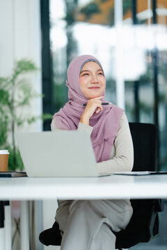 Portrait of women wearing hijab work thinking in office