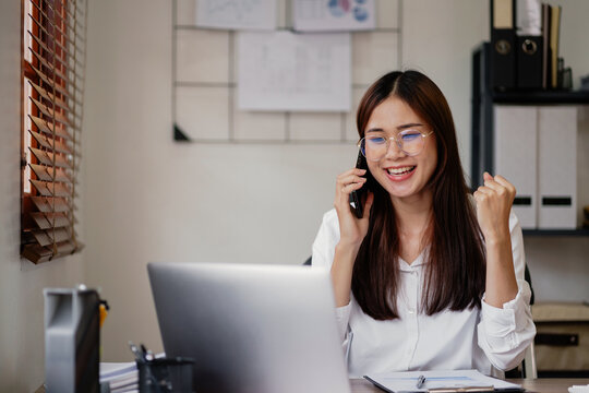 Excited business woman surprise looking on laptop having a good news