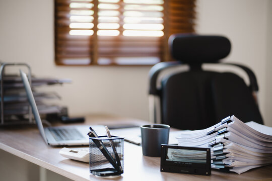 Stacks of file spreadsheets at office desk, overload work