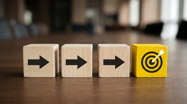 Wooden Arrow Blocks Pointing Toward Target Bullseye Representing Business Strategy and Goal Achievement