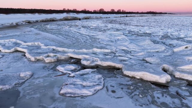 Ice toros on the Baltic Sea beach in Mikoszewo at sunrise. Poland