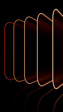 Stack of smartphones with glowing edge lighting in dark background