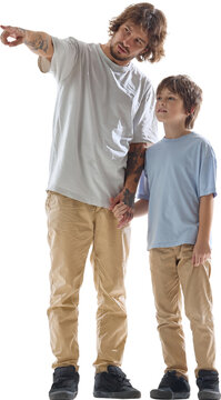 Young dad showing direction to curious son on transparent background. Family sightseeing, educational activities, casual fashion concept.
