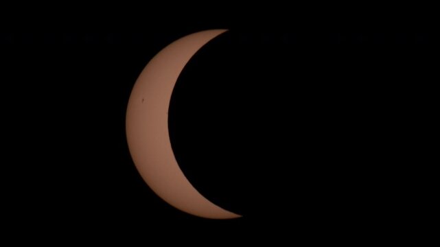 Partial Solar Eclipse Timelapse with Sunspots on Black Background