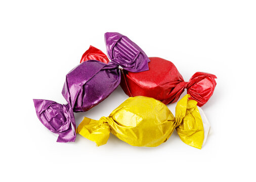 Colorful individually wrapped candies in red, yellow, and purple foil