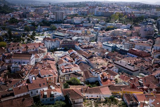 Panoramic elevated view of the historic center of Leiria Portugal with dense red tiled rooftops streets and surrounding neighborhoods