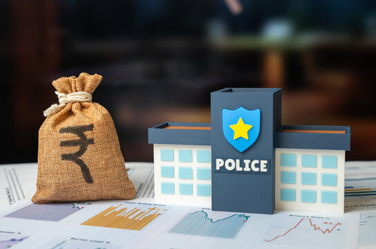 Police building and a indian rupee money bag. Budget replenishment through fines. Law enforcement budget. Expense optimization, improved working conditions for law enforcement officers.
