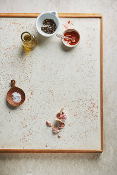Whole peppercorns, paprika powder, garlic cloves, Coarse salt