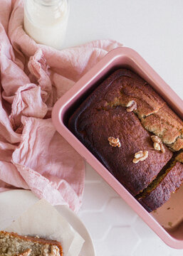 Vegetarian nut roast baked in pink loaf tin overhead view