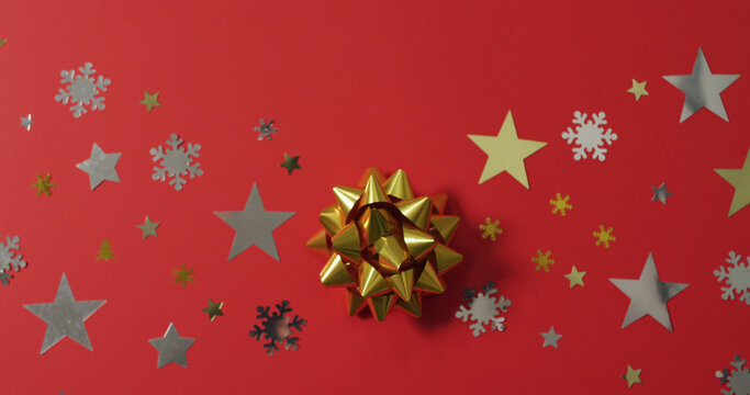 Christmas decorations with stars and snow patterns on red background