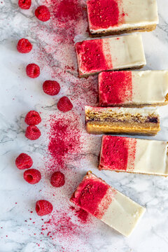 Dessert layer bars with raspberries and white chocolate topping