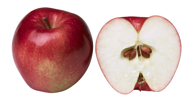 Whole red apple and a sliced apple half with visible seeds