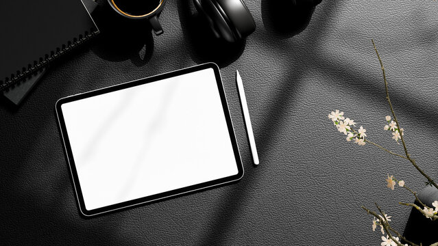 3D Illustration Top View Office Workspace with Blank Tablet Screen, Headphones, Notebook and Floral Decor on Dark Leather Desk