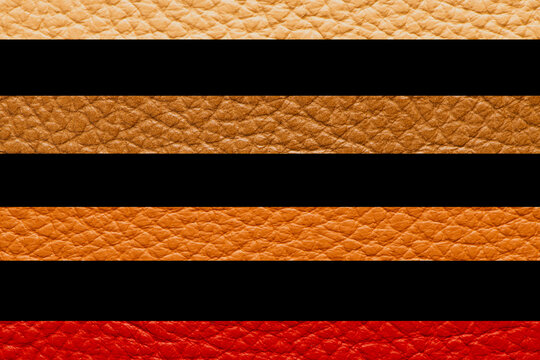 Horizontal stripes pattern of colorful leather textures in red orange brown and beige separated by black bands