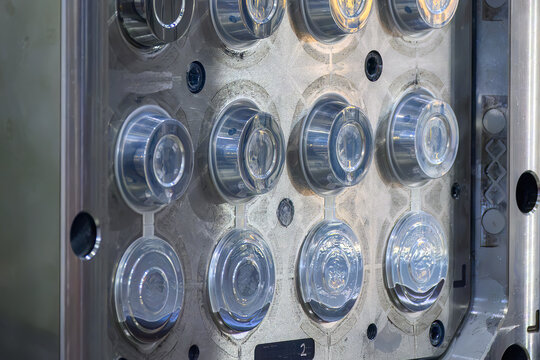 Close-up of a short shot defect on a plastic bowl part inside an injection mold machine