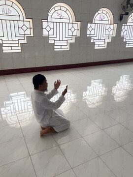 Muslim Man Praying Inside a Mosque