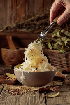 Traditional German sauerkraut on a old rustic wooden table.