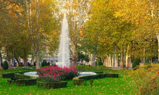 City park with flower, trees and fountain in autumn season with promenade, and colorful landscape, Zagreb, Croatia