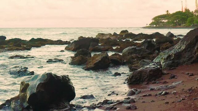 Waves Breaking on the Red Sand Of Koki Beach With Alau Island in the Distance, Koki Beach Park, Hana, Maui, Hawaii, USA